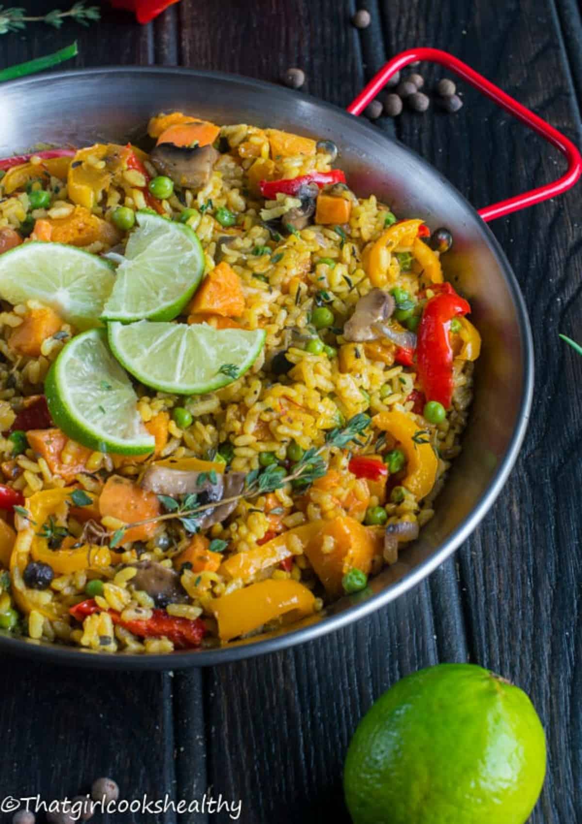 paella in the pan with lime