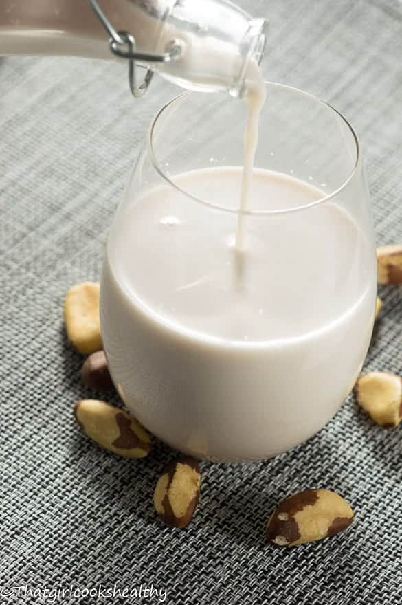 Poring a glass of Brazil nut milk