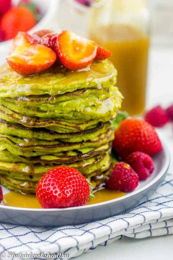 Pancakes drizzled with ginger syrup and fruit