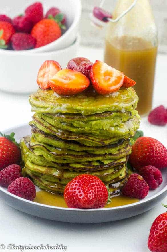  pancakes with fruit on plate