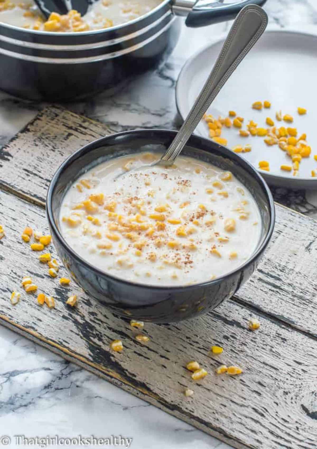 hominy porridge in a black bowl