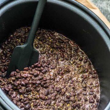Slow cooker black beans with spatula