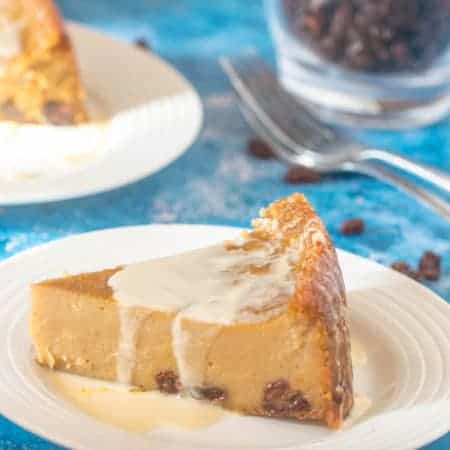 Jamaican cornmeal pudding A single slice of Jamaican cornmeal pudding with cream on top