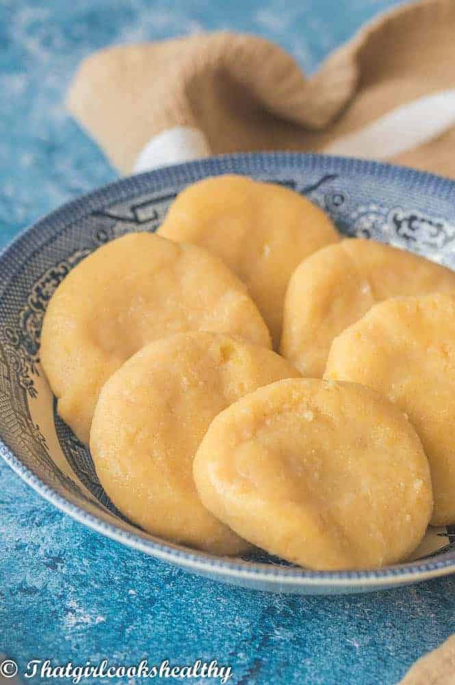 A very close up picture of the cornmeal dumplings in a bowl