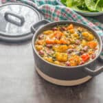 Curry in a grey casserole dish with a lid