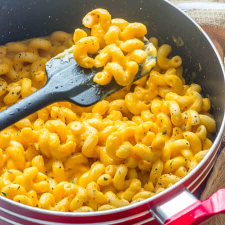 Spatula scooping up some macaroni