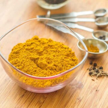 curry in a glass bowl with spoons