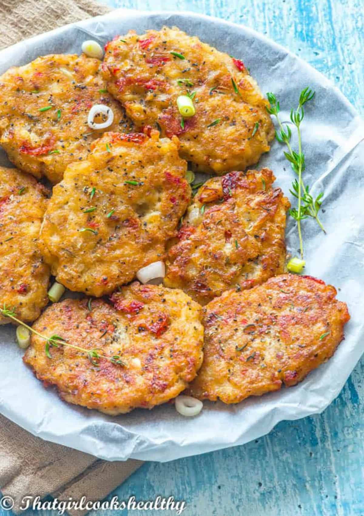 seven fritters on a plate