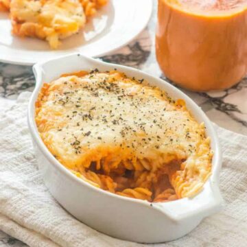 Pasta bake in a baking dish but with tomato sauce in a jar
