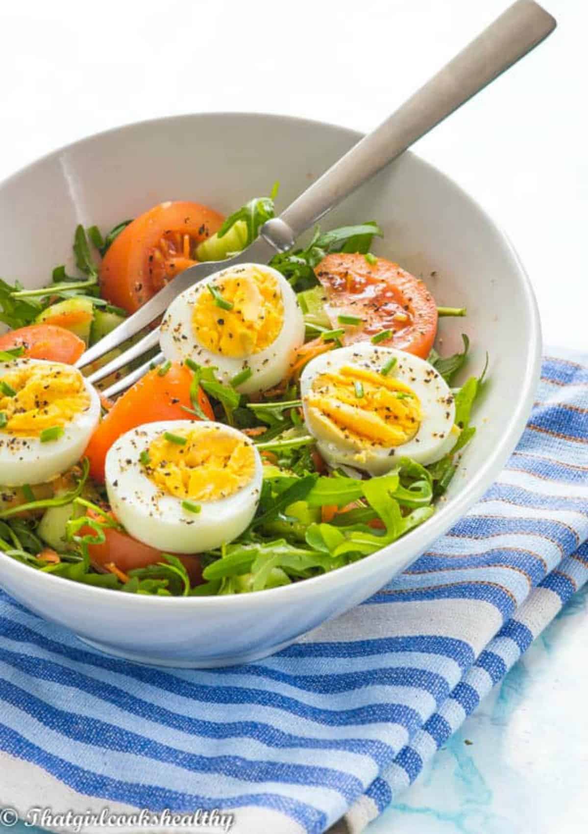 egg on a bed of salad