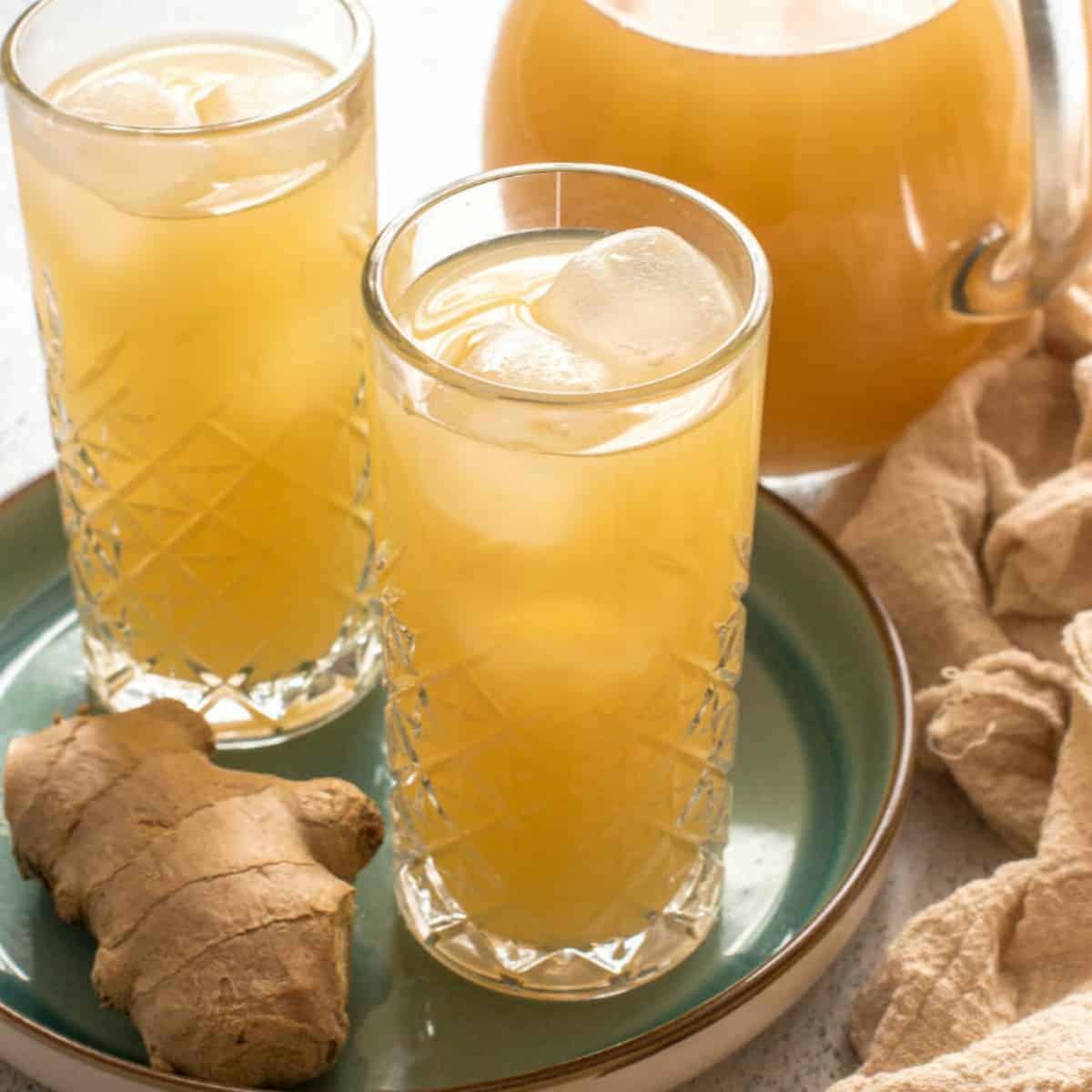 two glasses and jug of ginger beer