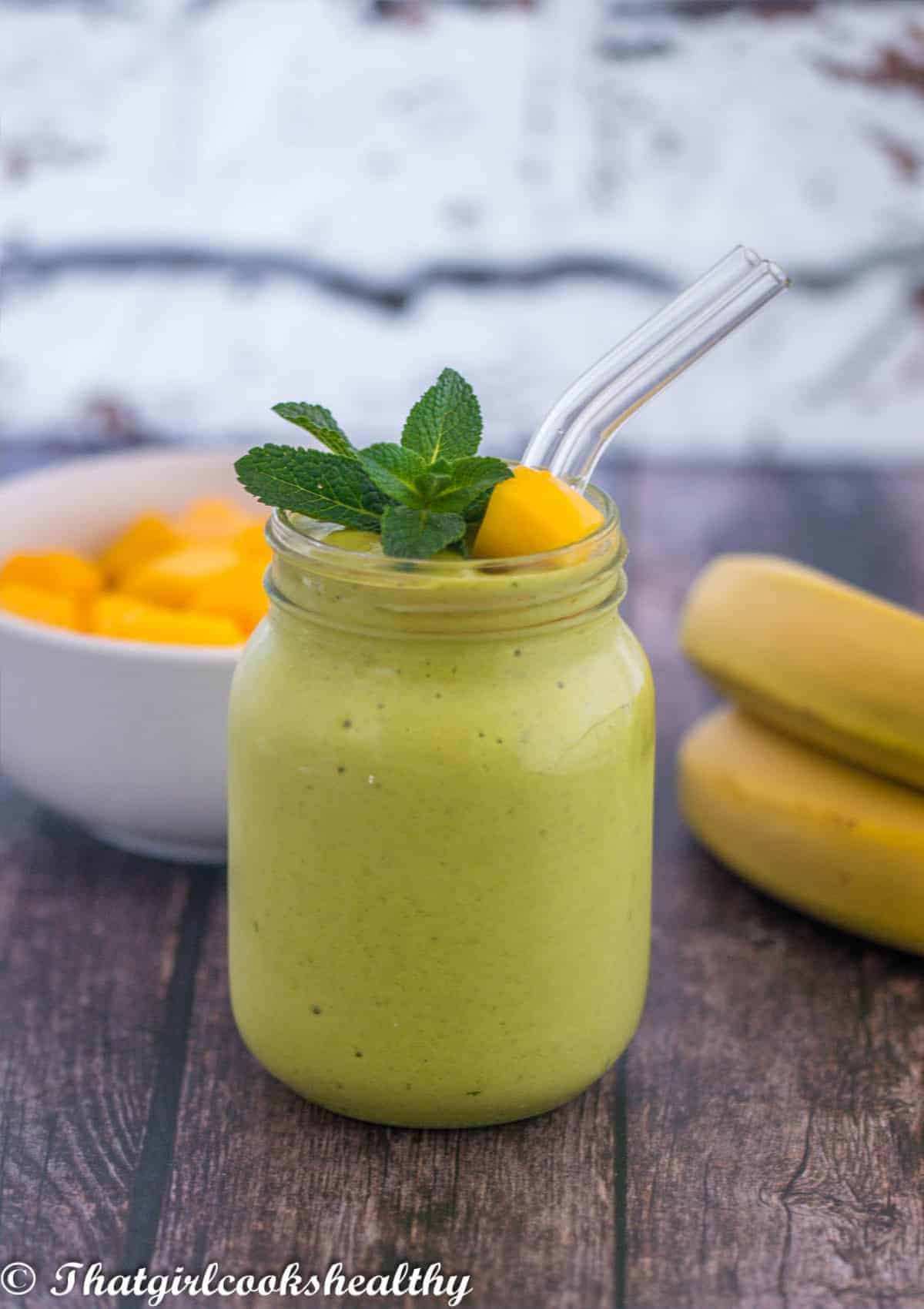 Green smoothie in a mason jar with garnish