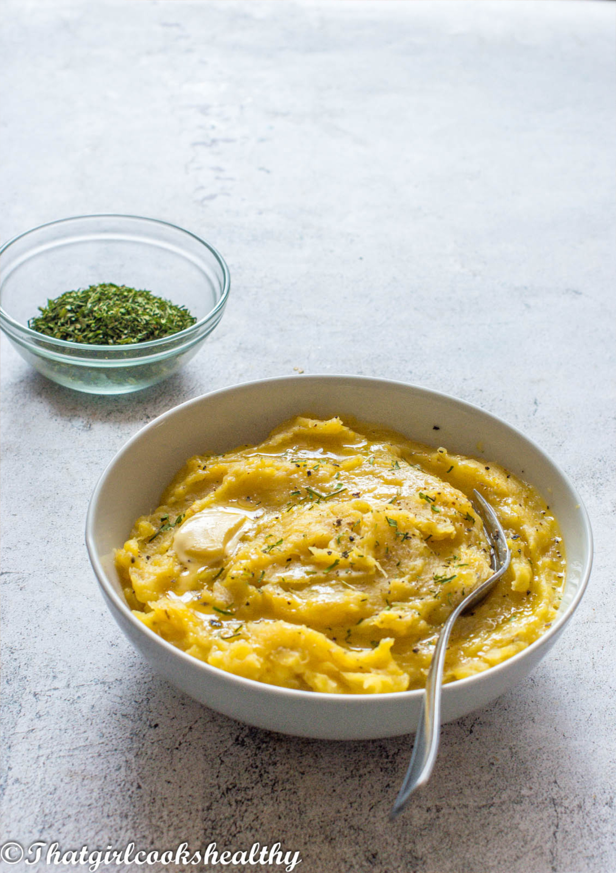 mashed plantain with a fork