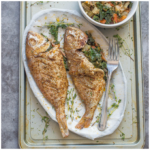 Stuffed fish on a baking tray