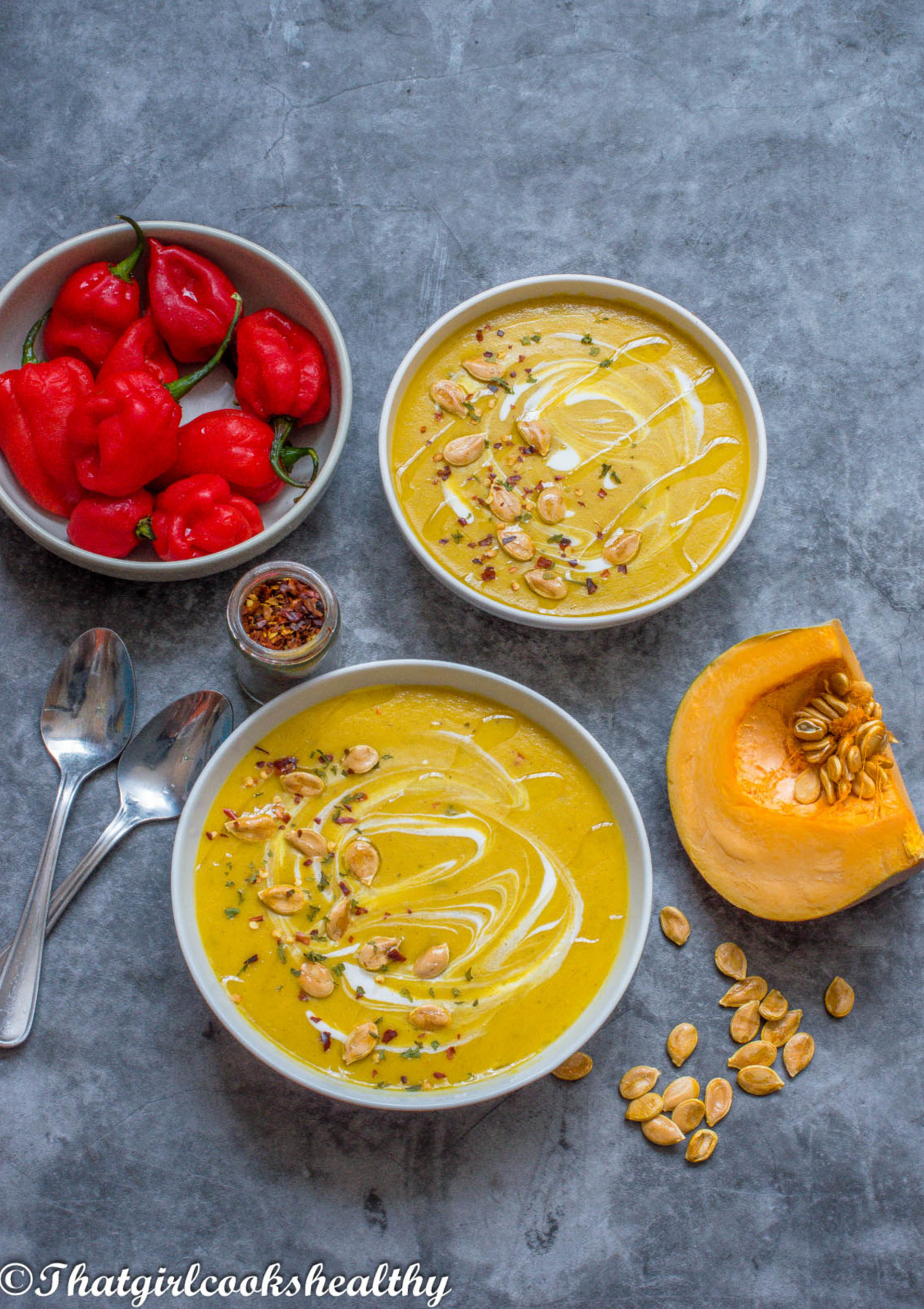 2 bowls of soup with scotch bonnet in a bowl