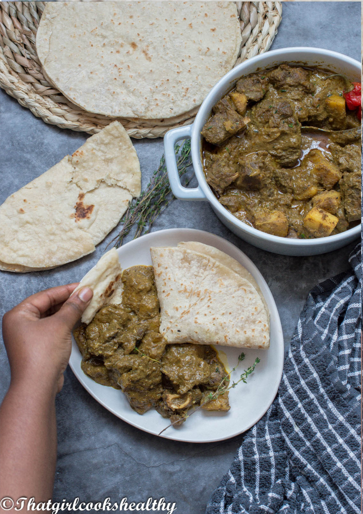 curry goat scooped up with some roti