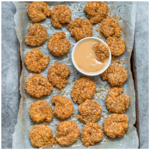 shrimp on a baking tray with dip