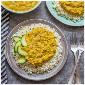 dhal on a bed of cauliflower rice with cucumber
