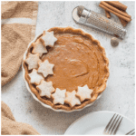 Pie with decor and serving plates