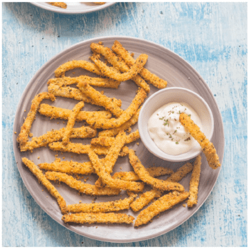 Fries on a plate with a vegan mayo dip