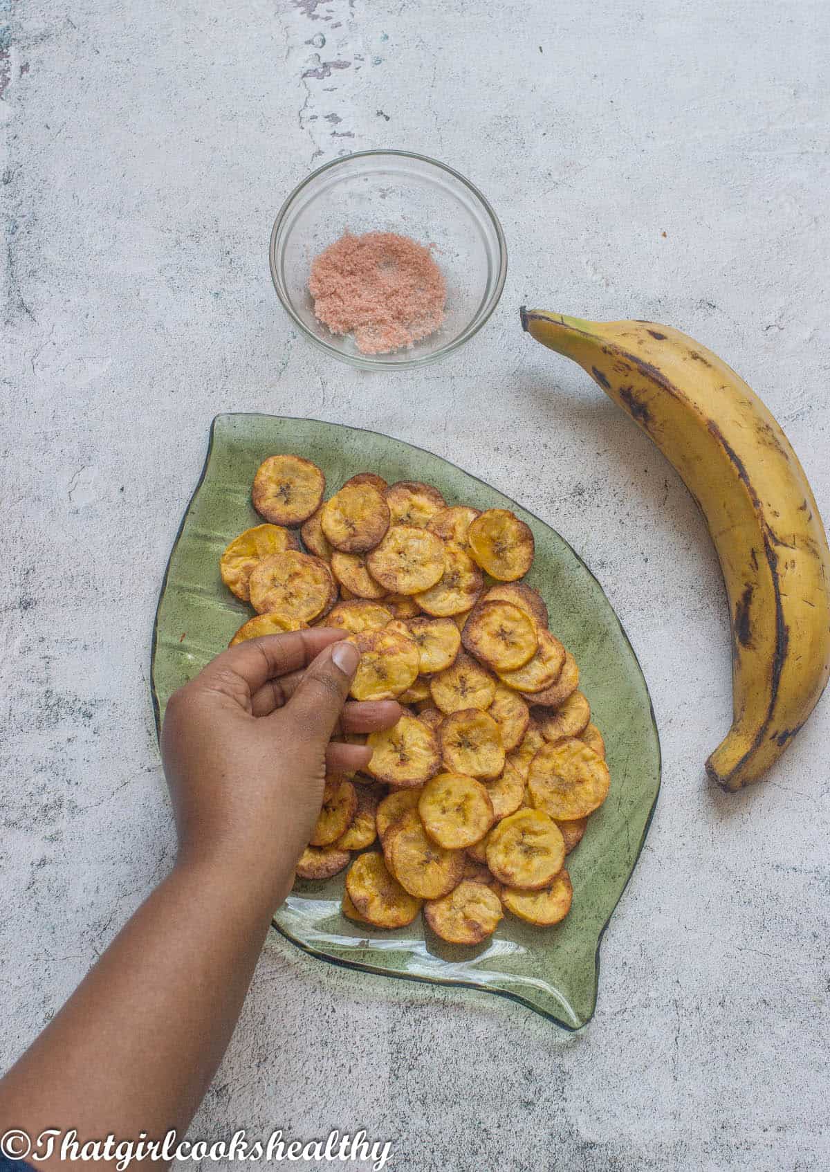 Arm grabbing some plantain chips
