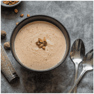 Single bowl of peanut porridge with spoons