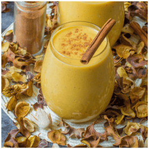 Punch with cinnamon stick resting on the top.