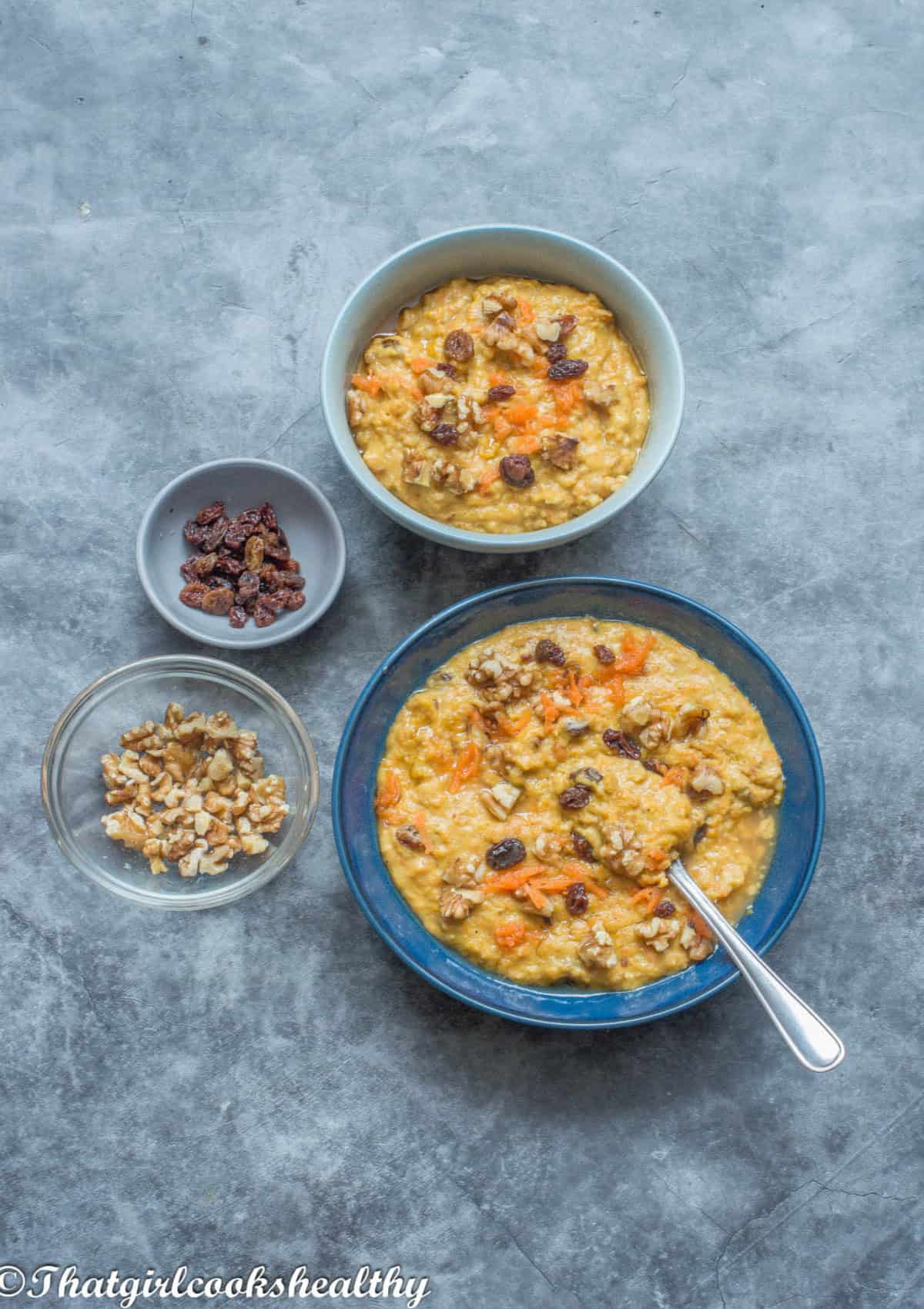 Porridge in a blue bowl with topping.