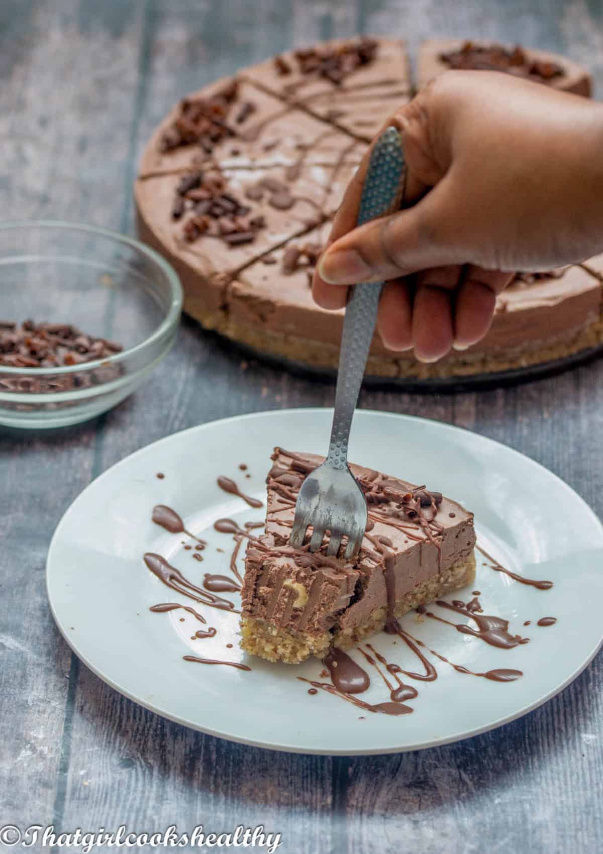 Fork scooping up the cheesecake