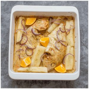 2 snapper with yuca and oranges garnished
