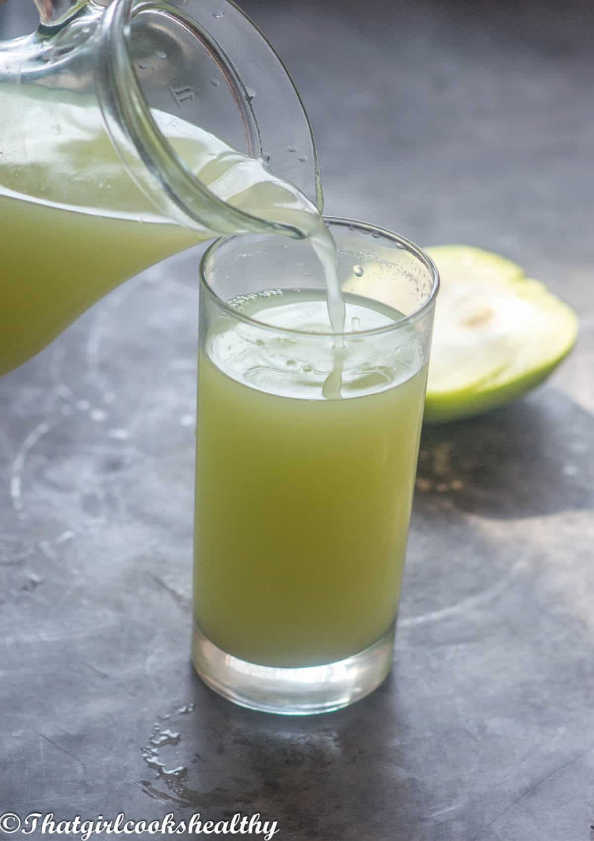 Pouring out a glass of chayote water