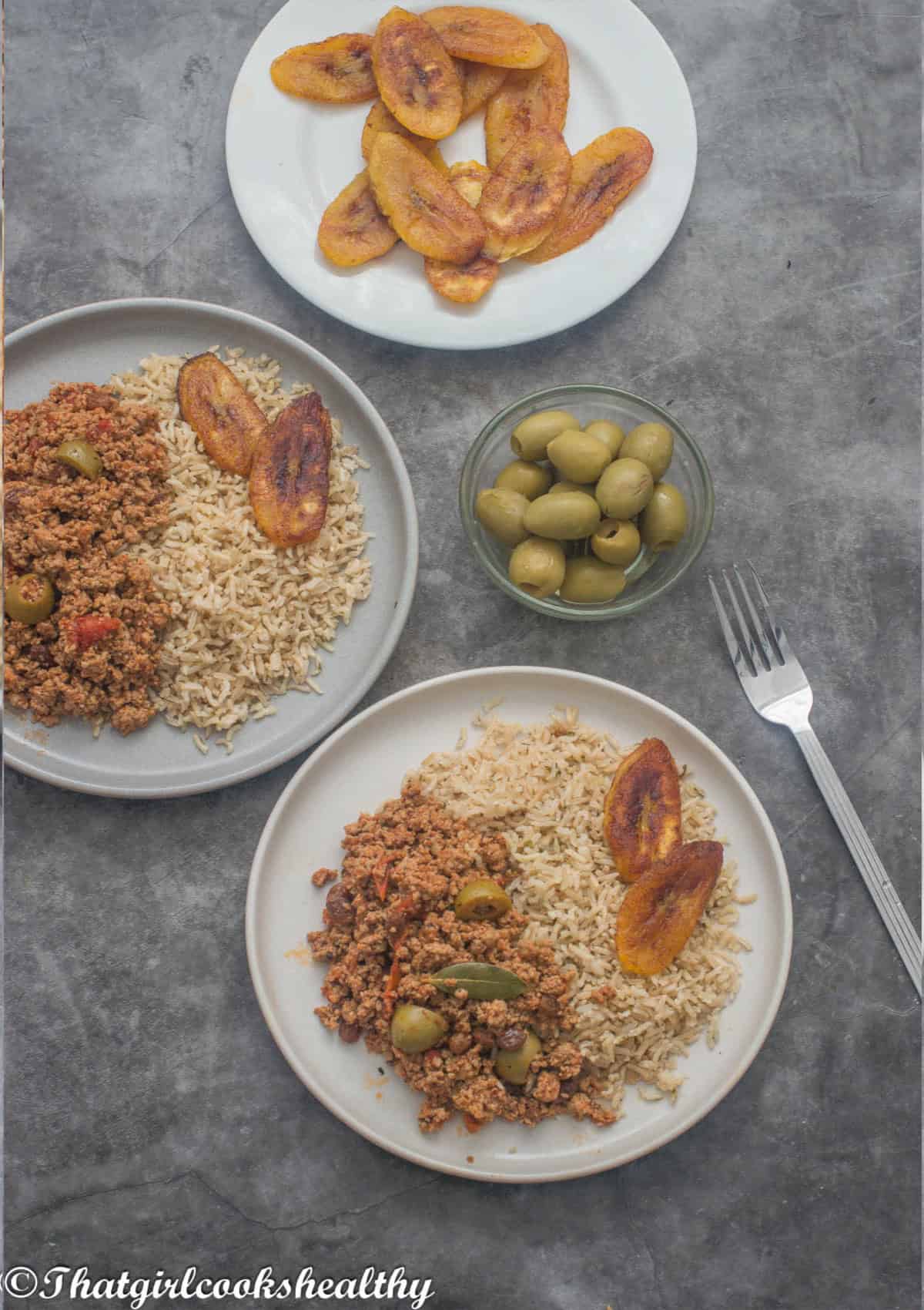 A plate of ground turkey, plantain and rice