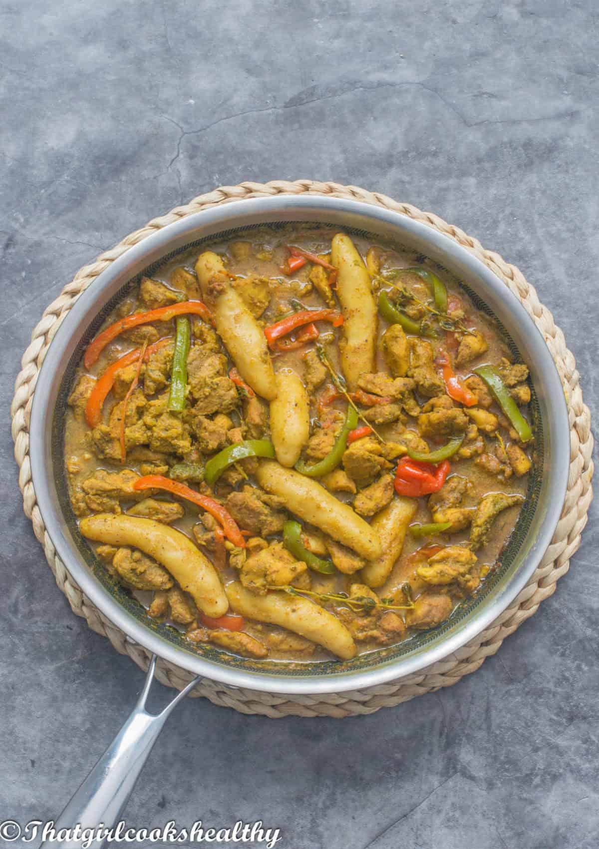 Curry chicken with spinner dumplings, peppers, and seasoning