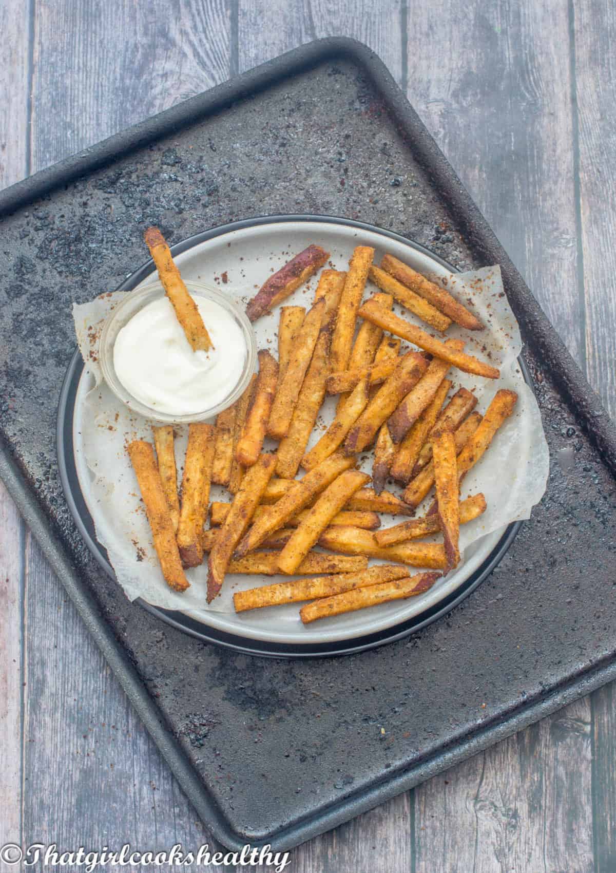 Fries on a plate with a dipping sauce