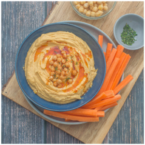 Hummus dip with sliced carrots