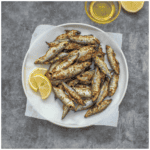 fish on a plate with garnish