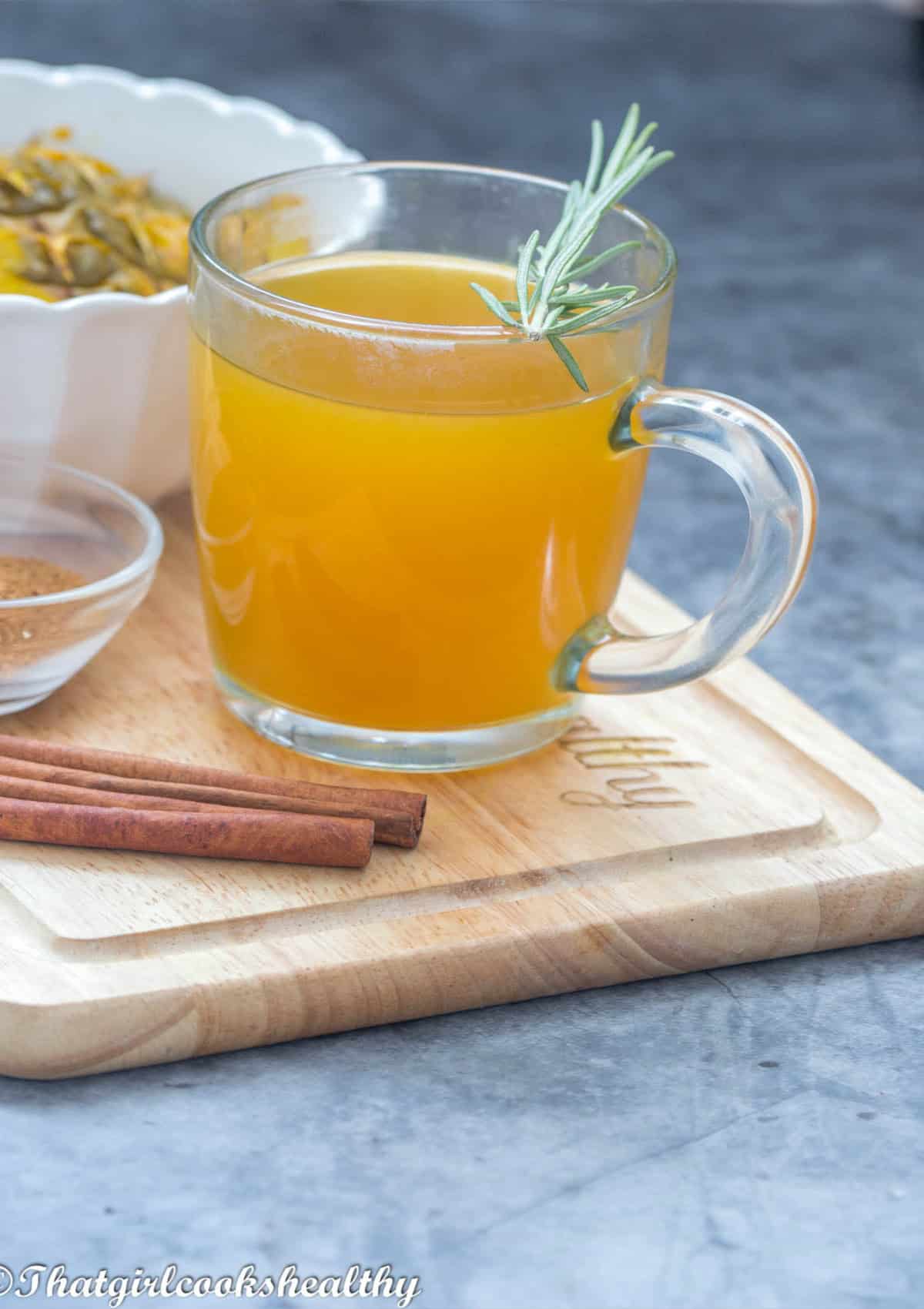tea on a board with rosemary garnish