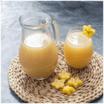Jug and glass of starfruit juice