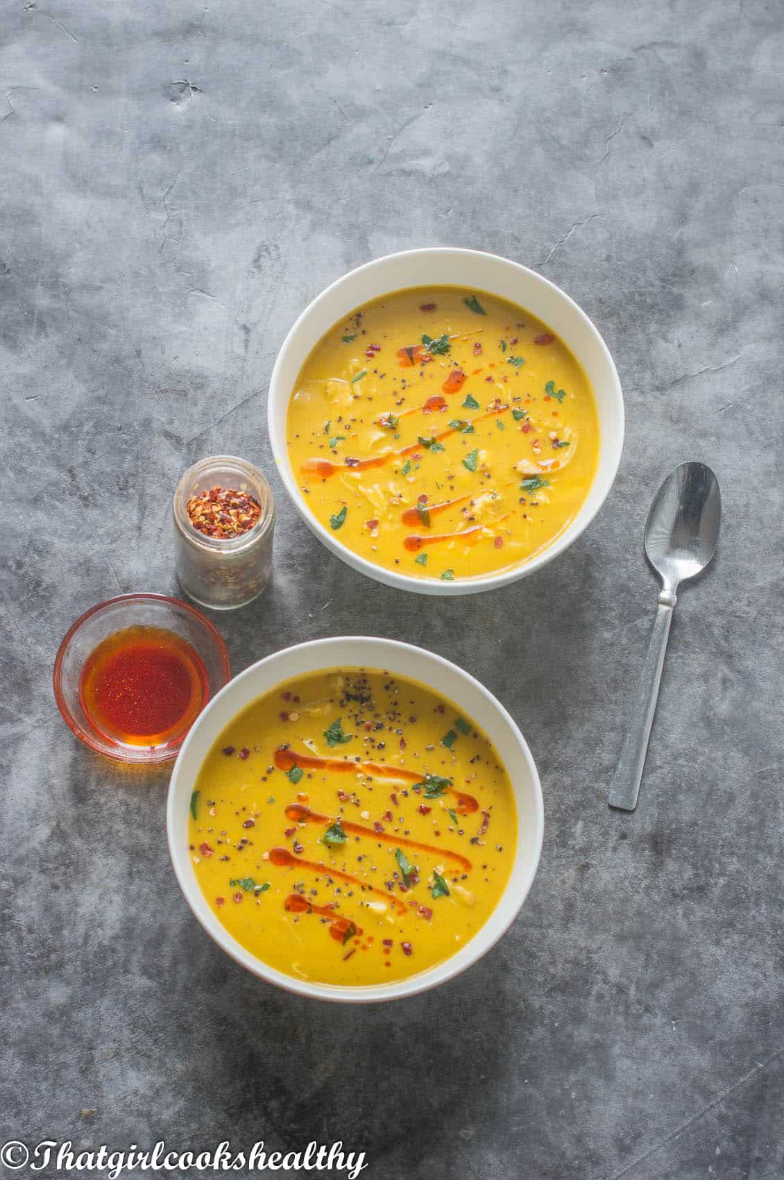 soup with garnish and a spoon