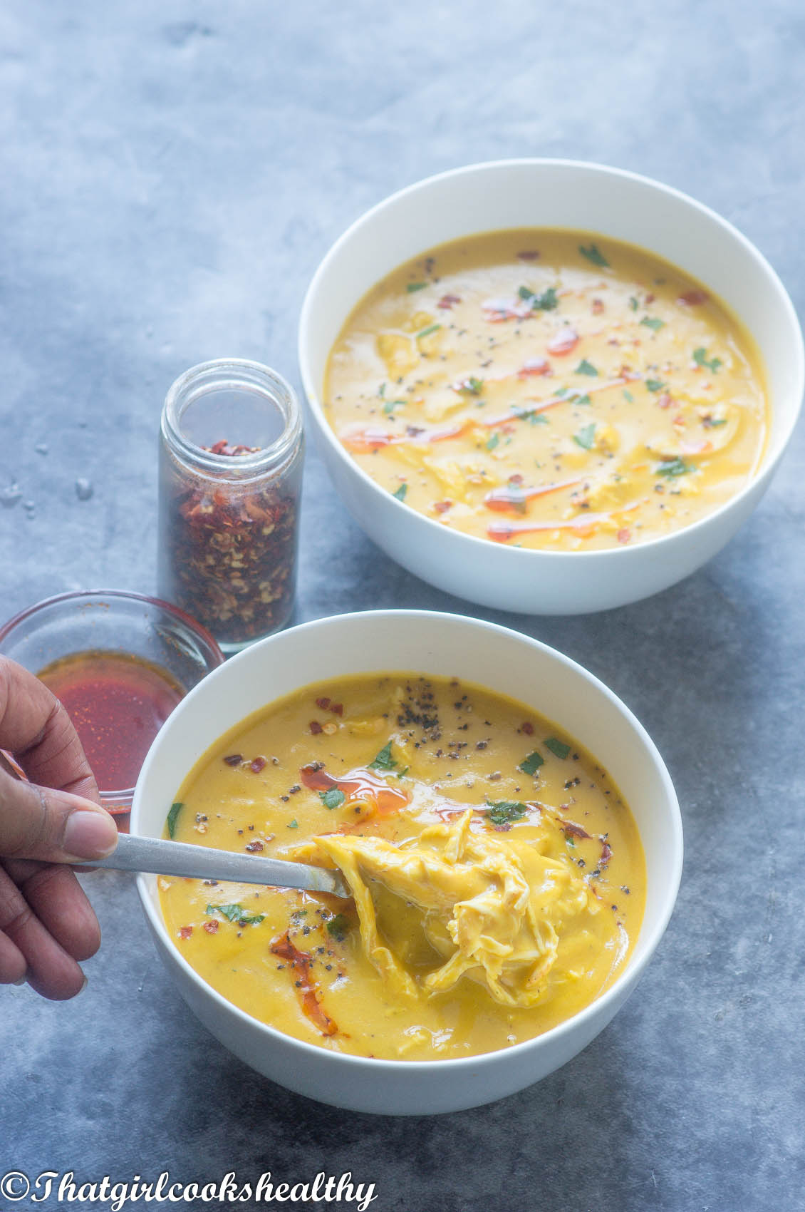 spoon scooping up some soup